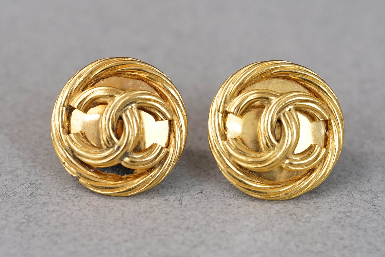 CHANEL EARRINGS: CHANEL EARRINGS, gold coloured, clip on, dimensions 30mm. If you have any questions regarding this lot please contact us. For further information on our auction, please refer to our T & Cs. We do