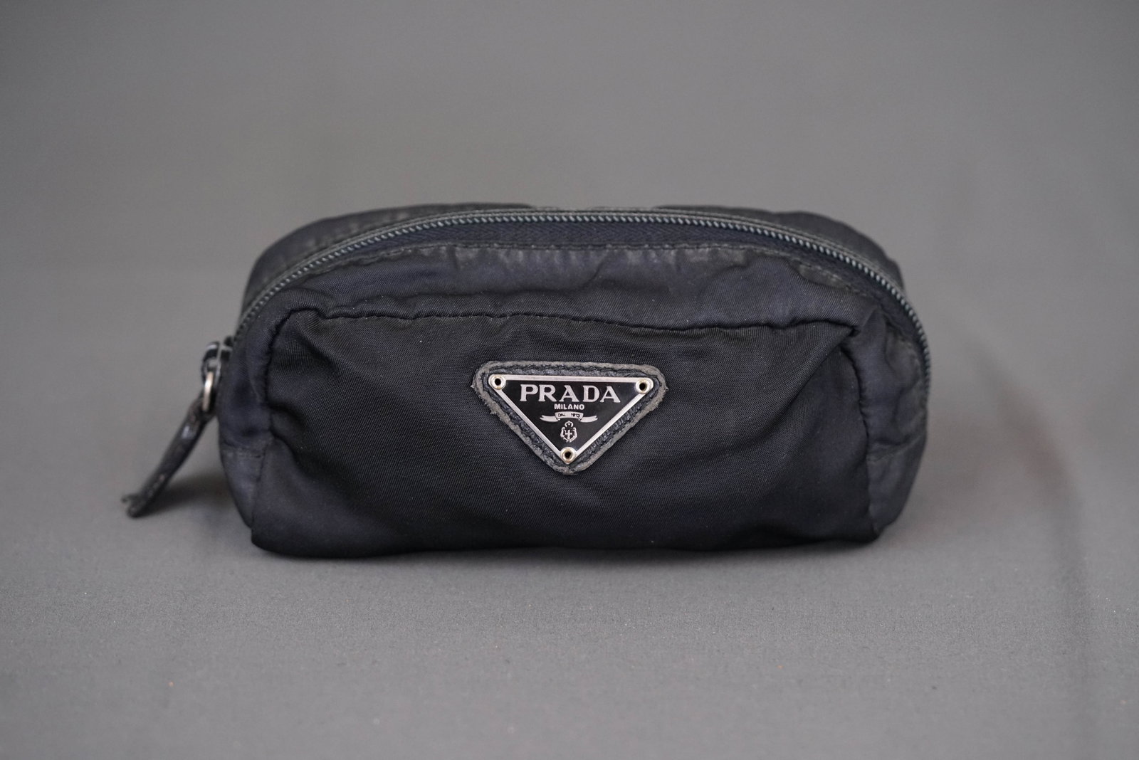 PRADA NYLON POUCH: PRADA NYLON POUCH, width 15 cm, height 7cm, depth 5cm. If you have any questions regarding this lot please contact us. For further information on our auction, please refer to our T & Cs. We do