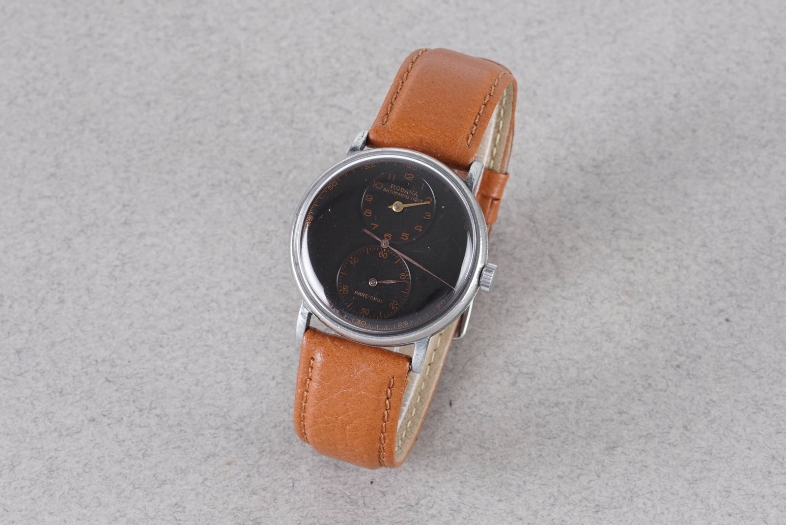 RODANA ANTI-MAGNETIC REGULATOR DOCTORS WRISTWATCH: RODANA ANTI-MAGNETIC REGULATOR DOCTORS WRISTWATCH, this watch is fitted with a circular black dial with hour markers and hands. The 33mm stainless steel case is fitted with a crown and a case back.