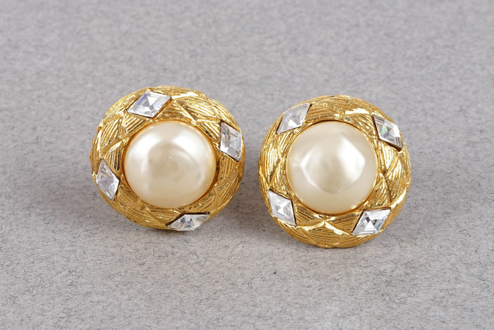 CHANEL GOLD PLATED PEARL CLIP ON EARRINGS: CHANEL GOLD PLATED PEARL CLIP ON EARRINGS with faux pearl and diamonds, approx. dimensions 2.7cm, If you have any questions regarding this lot please contact us. For further information on our