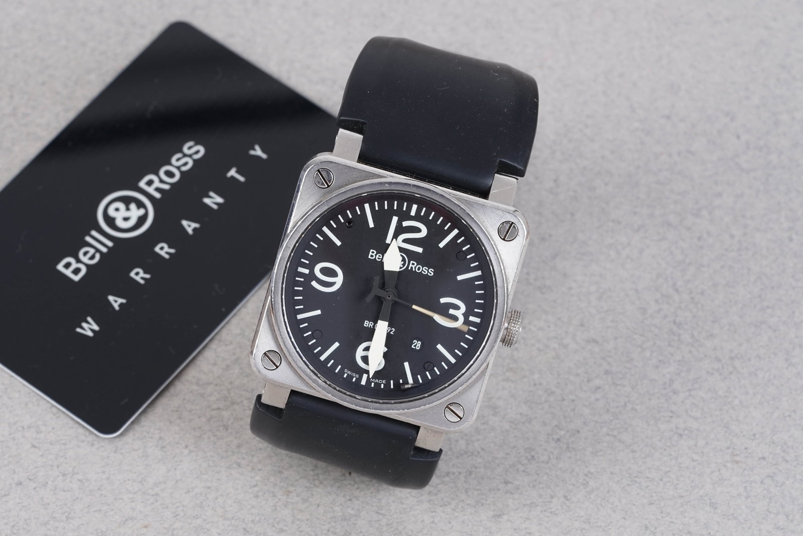 BELL & ROSS AVIATION W/ BOX & PAPERS REF. BR03-92-S: BELL & ROSS AVIATION W/ BOX & PAPERS REF. BR03-92-S, this watch is fitted with a black square dial with date window, 3,6,,9 hour markers and sword hands. The 42mm square steel case is fitted