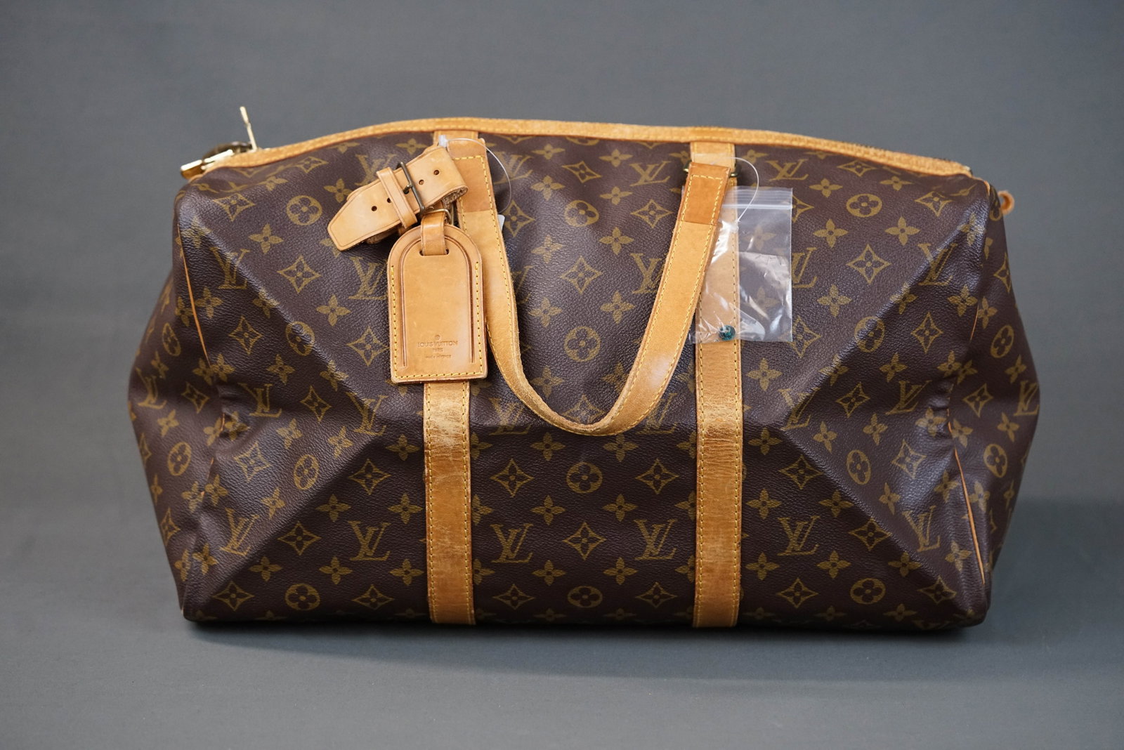 LOUIS VUITTON MONOGRAM 45 KEEPALL BOSTON BAG M41428: LOUIS VUITTON MONOGRAM 45 KEEPALL BOSTON BAG M41428, width cm, height cm, depth cm. If you have any questions regarding this lot please contact us. For further information on our auction, please