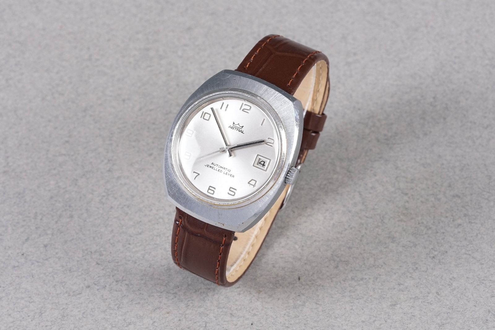 ASTRAL AUTOMATIC DATE WRISTWATCH: ASTRAL AUTOMATIC DATE WRISTWATCH, this watch is fitted with a circular silver dial with a date window, arabic numeral hour markers and hands. The 37mm case is fitted with a crown and a case back. Insi
