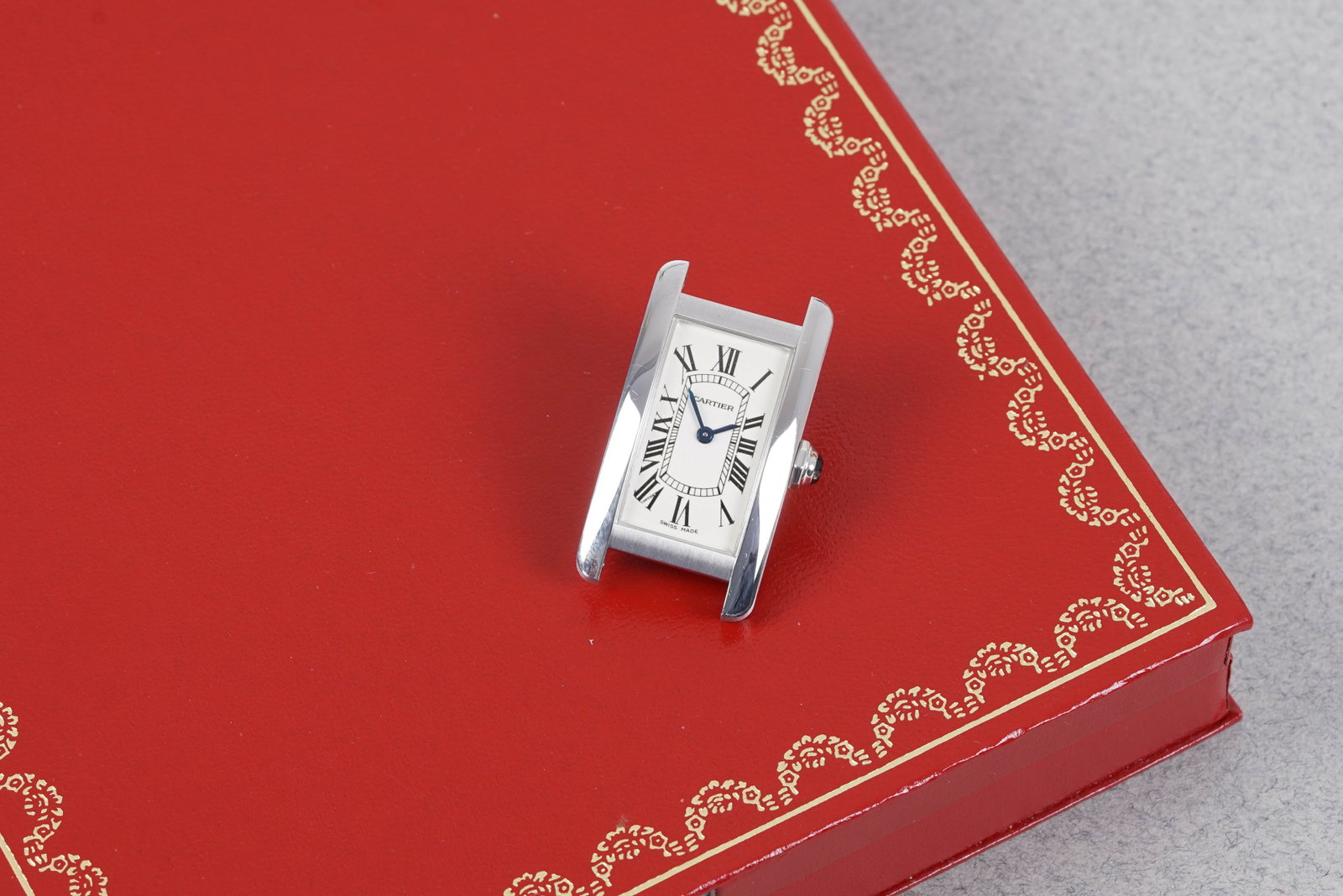 CARTIER TANK AMERICAINE 18CT WHITE GOLD W/ BOX & PAPERS REF. W2601956 CIRCA 2004: CARTIER TANK AMERICAINE 18CT WHITE GOLD W/ BOX & PAPERS REF. W2601956 CIRCA 2004, this watch is fitted with a white oblong dial with, roman numeral hour markers and blue sword hands. The 19mm