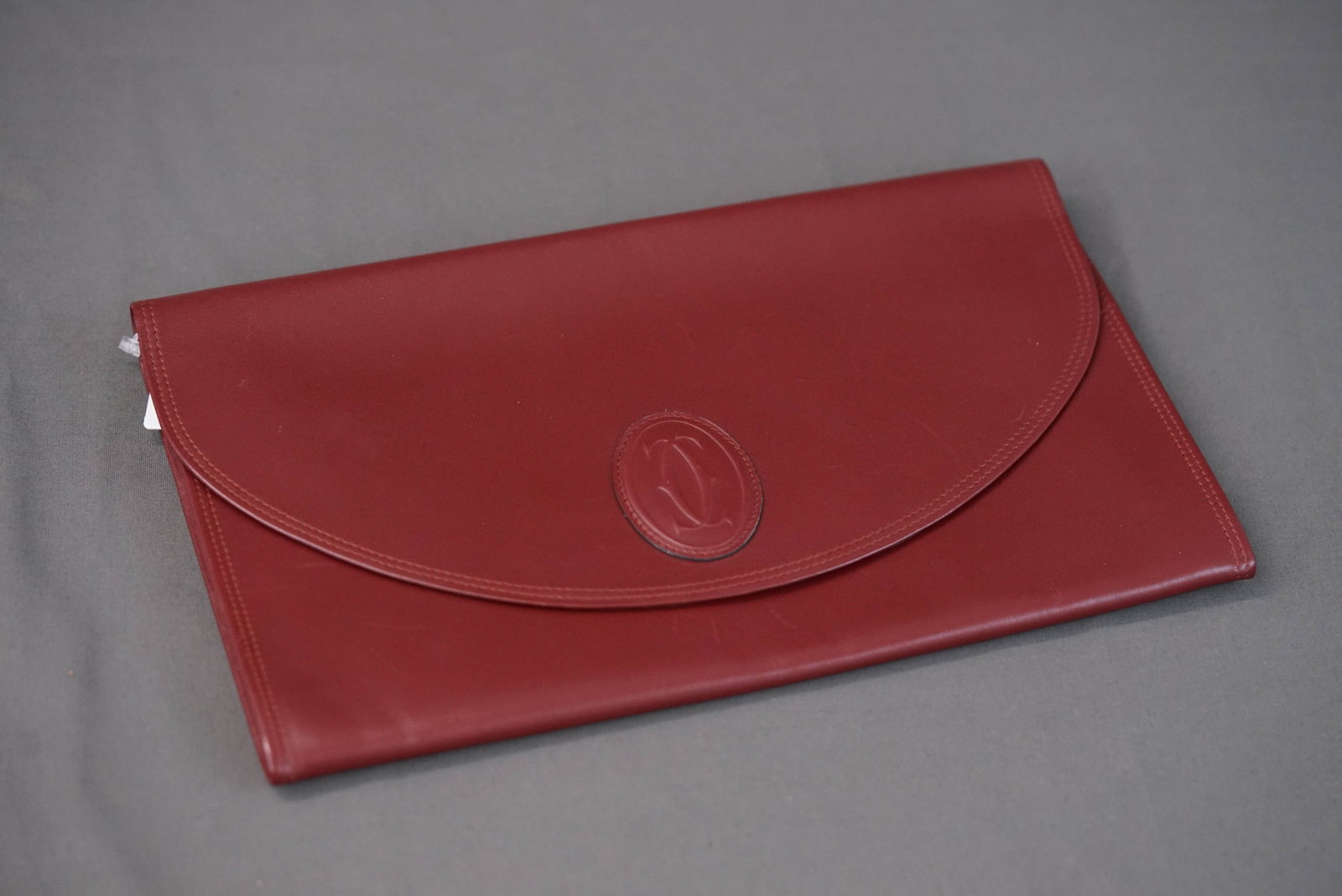 CARTIER RED LEATHER FOLIO DOCUMENT POUCH: CARTIER RED LEATHER FOLIO DOCUMENT POUCH, width 28cm, height 17cm, depth 7cm. If you have any questions regarding this lot please contact us. For further information on our auction, please refer to