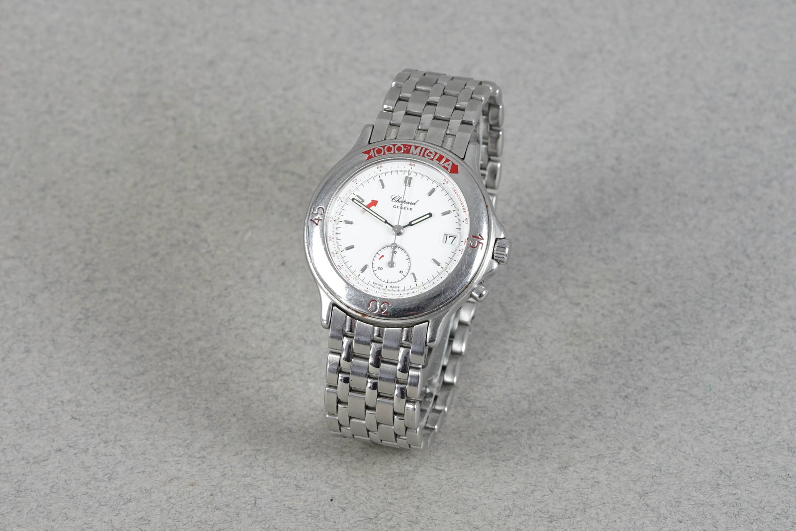 CHOPARD MILLE MIGLIA WRISTWATCH 15/8153 272989: CHOPARD MILLE MIGLIA WRISTWATCH 15/8153 272989 DIAL: Circular white dial, silver hour markers, date window CASE: 35mm stainless steel case with crown and pusher MOVEMENT: Quartz movement BRACELET OR S