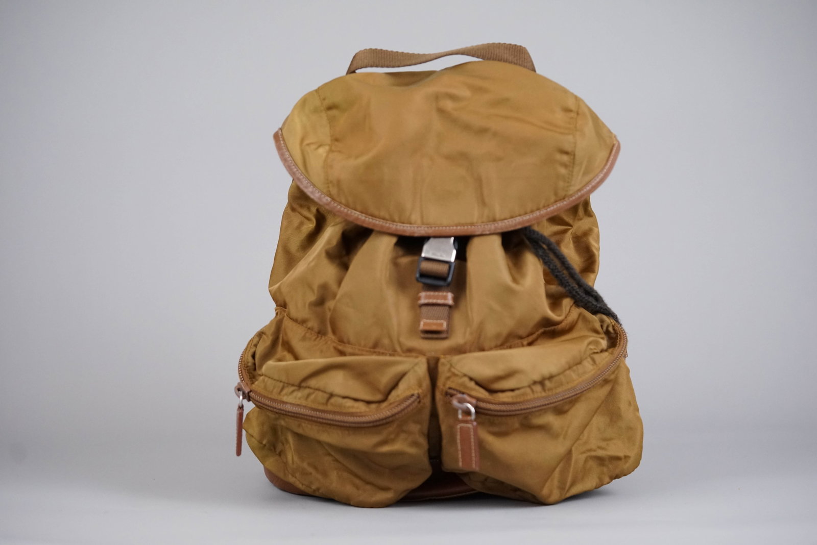 PRADA KHAKI/LIGHT BROWN NYLON BACKPACK: PRADA KHAKI/LIGHT BROWN NYLON BACKPACK, width 28cm, height 32cm, 16 depth cm. If you have any questions regarding this lot please contact us. For further information on our auction, please refer to
