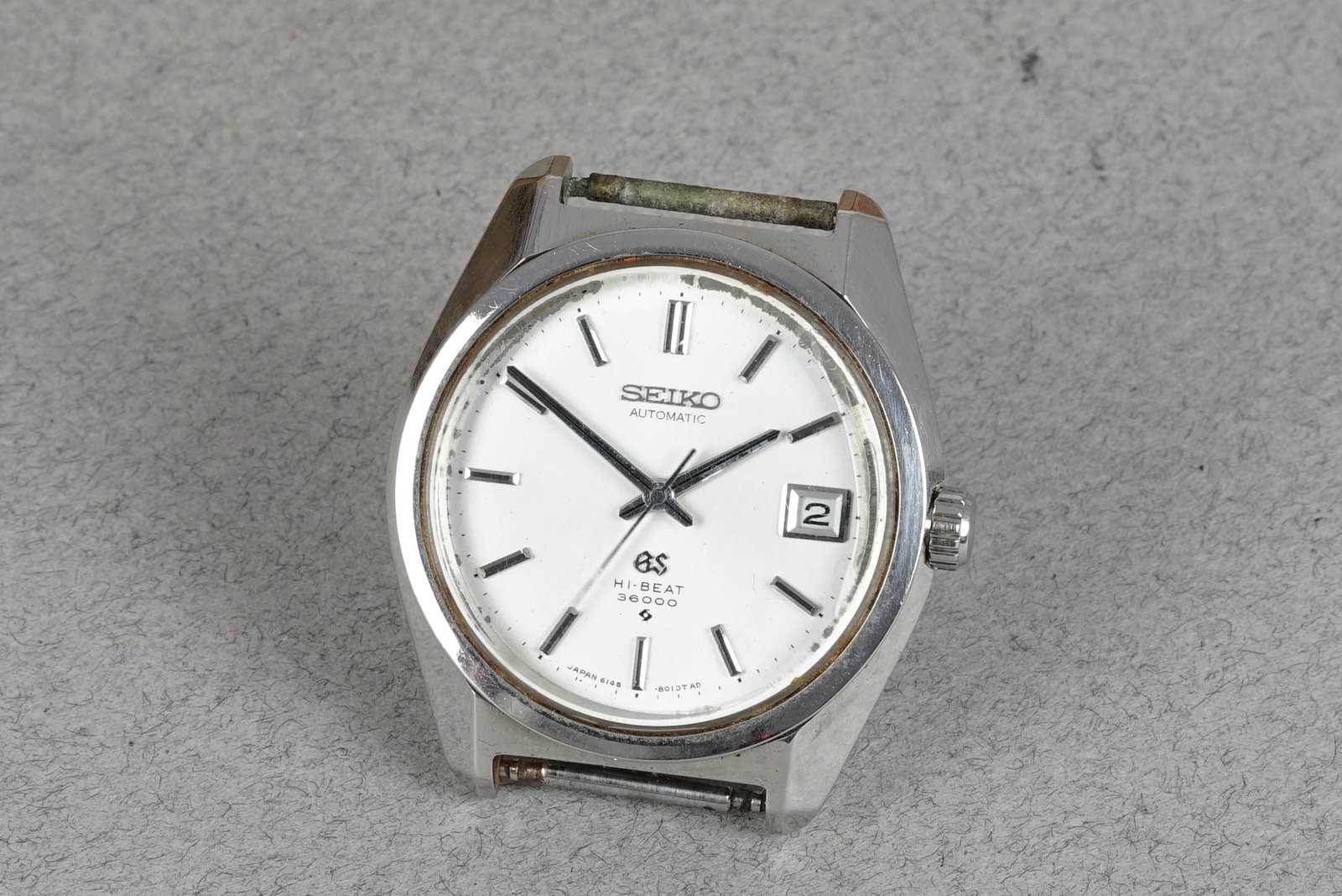 GRAND SEIKO HI-BEAT 36000 REF. 6145-8000: GRAND SEIKO HI-BEAT 36000 REF. 6145-8000 DIAL: Dial with applied indices, date window, hands with Lume CASE: 36mm stainless steel, screw-down case back, hi-beat movement MOVEMENT: Automatic hi-beat