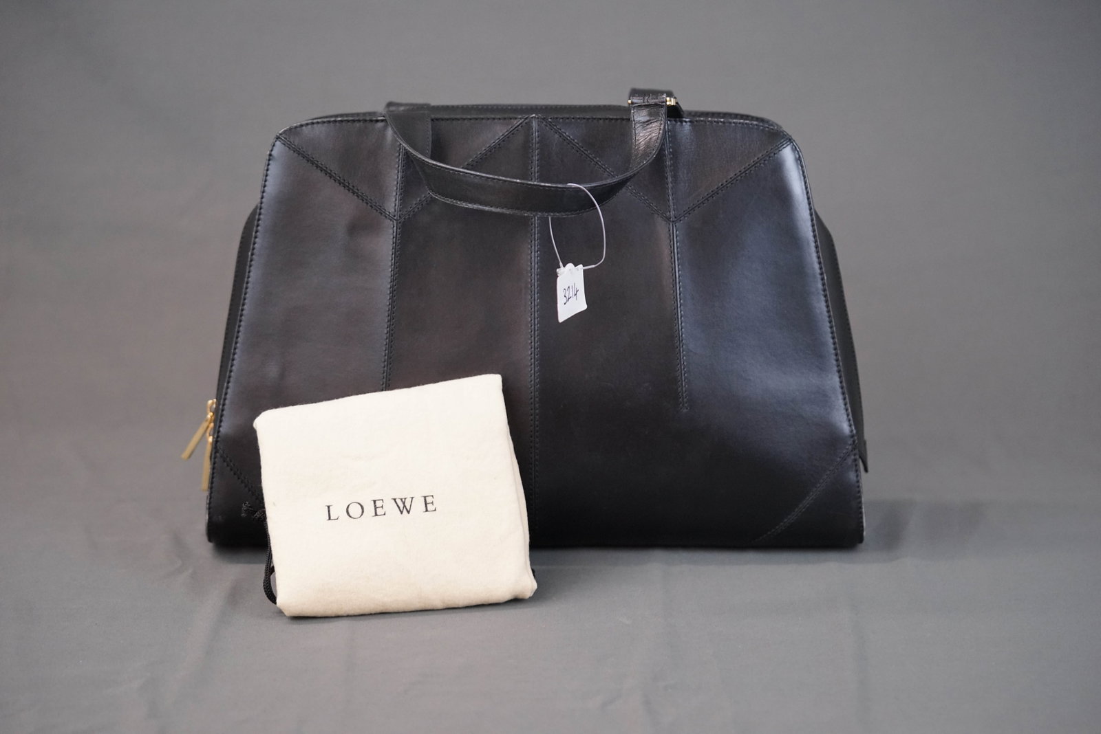 LOEWE ANAGRAM BLACK LEATHER HANDBAG: LOEWE ANAGRAM BLACK LEATHER HANDBAG, width cm, height cm, depth cm. If you have any questions regarding this lot please contact us. For further information on our auction, please refer to our T &
