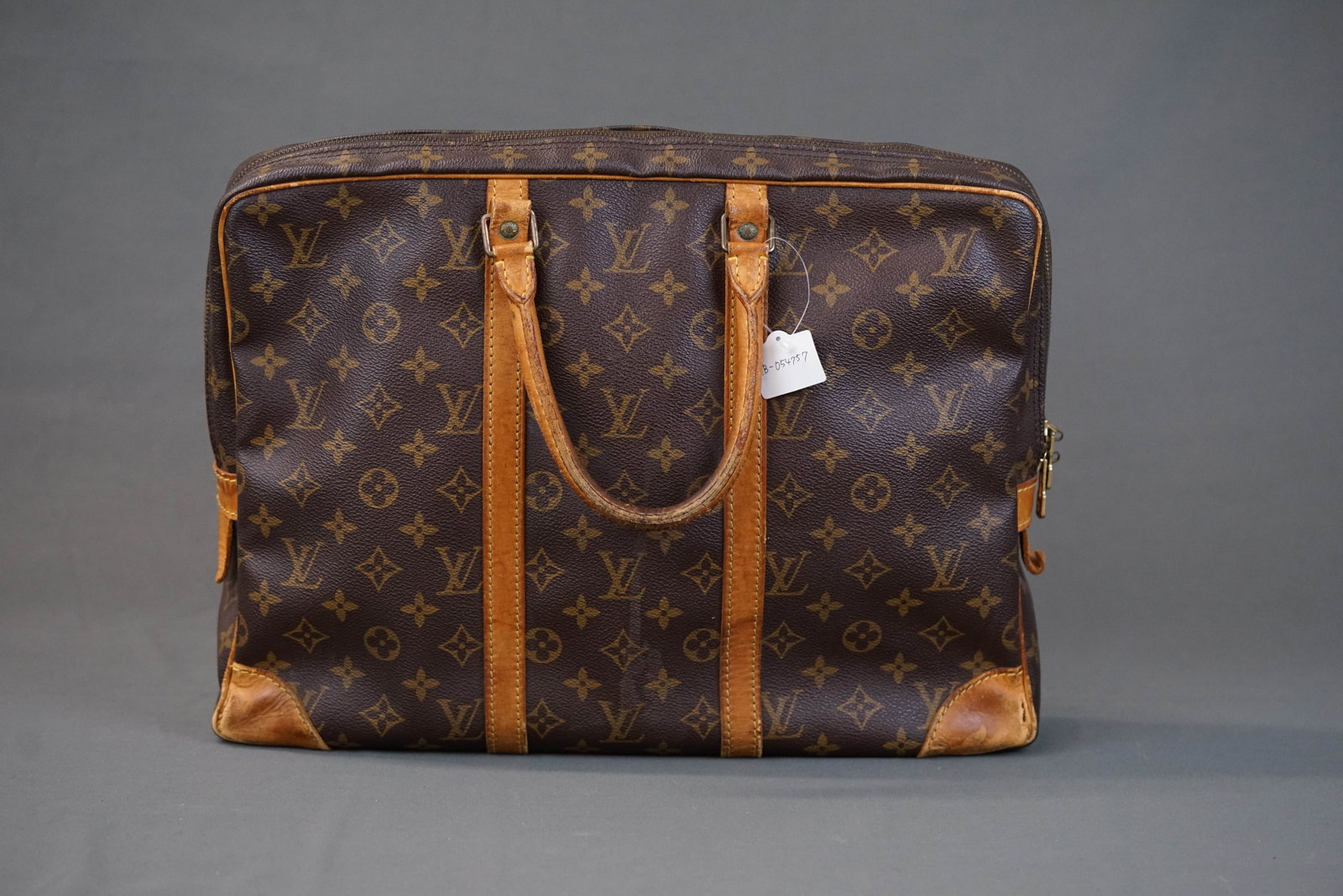 LOUIS VUITTON MONOGRAM PORTE CLEMENT VOYAGE BRIEFCASE M40226 VI0923: LOUIS VUITTON MONOGRAM PORTE CLEMENT VOYAGE BRIEFCASE M40226 VI0923 If you have any questions regarding this lot please contact us. For further information on our auction, please refer to our T &