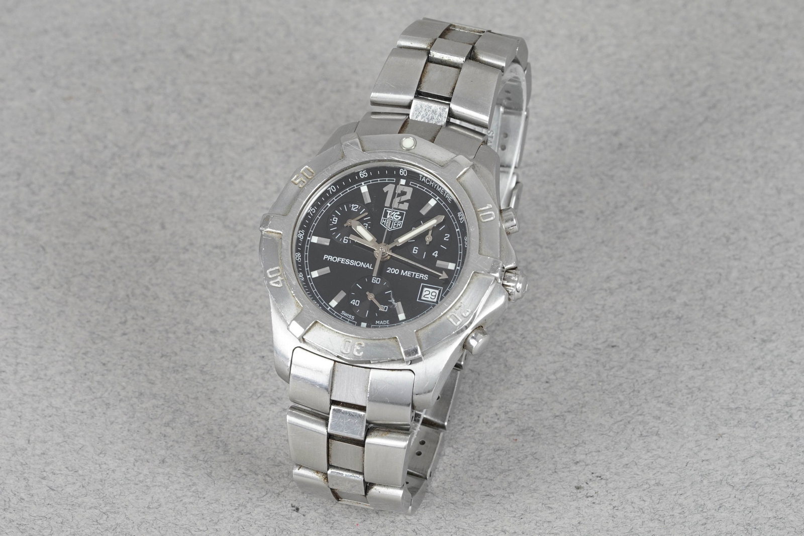 TAG HEUER PROFESSIONAL 200 CHRONOGRAPH REF. CN1110: TAG HEUER PROFESSIONAL 200 CHRONOGRAPH REF. CN1110 DIAL: Black dial, chronograph sub dials, applied indices, date window CASE: 42mm stainless steel, screw-down crown and case back, 200m water