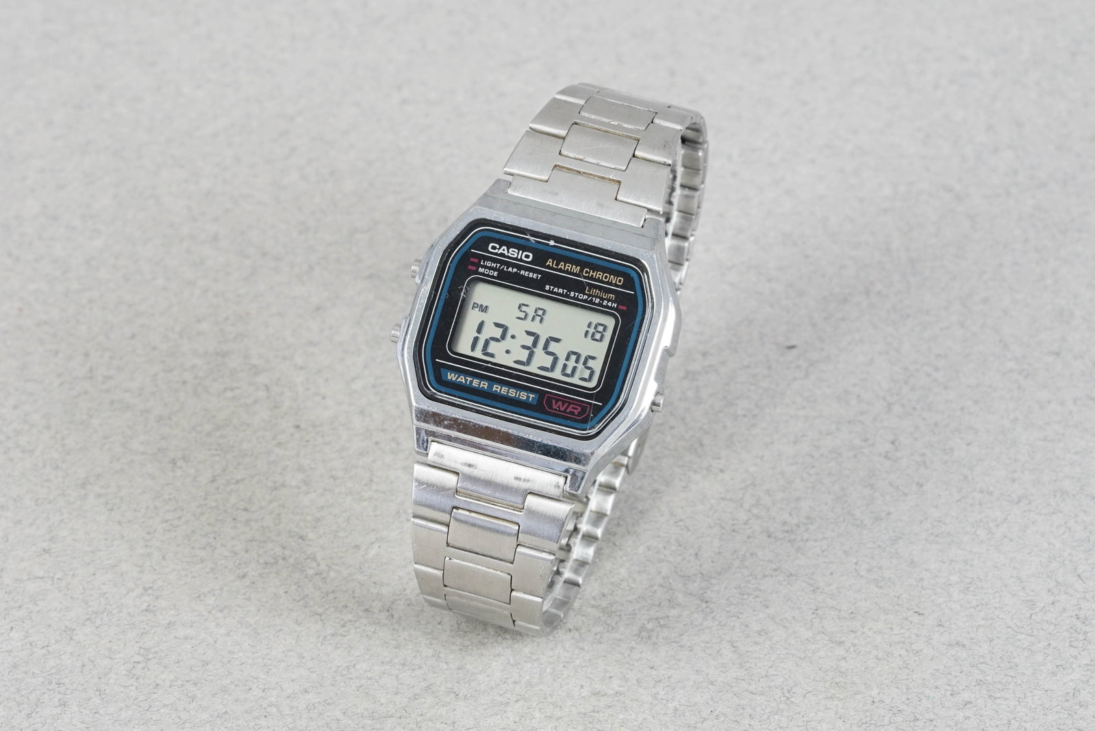 CASIO DIGITAL ALARM CHRONOGRAPH: CASIO DIGITAL ALARM CHRONOGRAPH DIAL: Digital display CASE: 33mm case, pushers MOVEMENT: Quartz BRACELET OR STRAP: Casio bracelet ACCESSORIES: N/A CONDITION NOTES: Glass has some scratches, case and