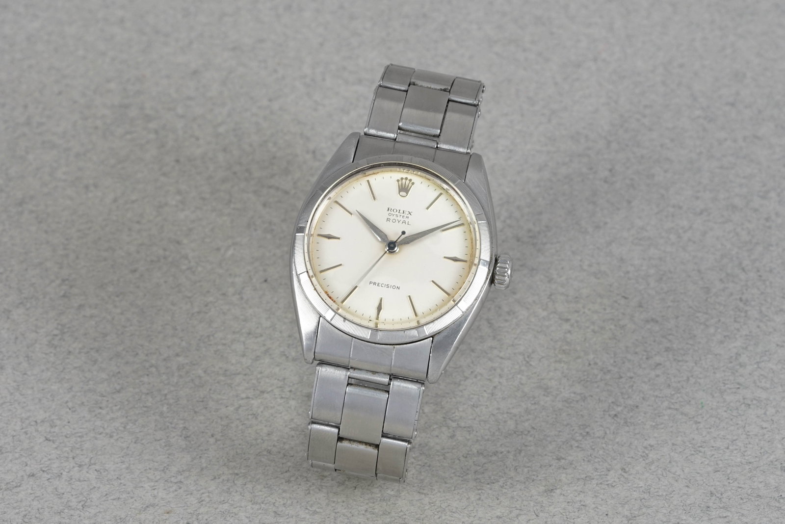 ROLEX OYSTER ROYAL PRECISION REF. 6427: ROLEX OYSTER ROYAL PRECISION REF. 6427 DIAL: circular white dial, baton markers and dauphine hands CASE: 35mm steel case, engine turned bezel, Rolex crown. MOVEMENT: Rolex manual movement running