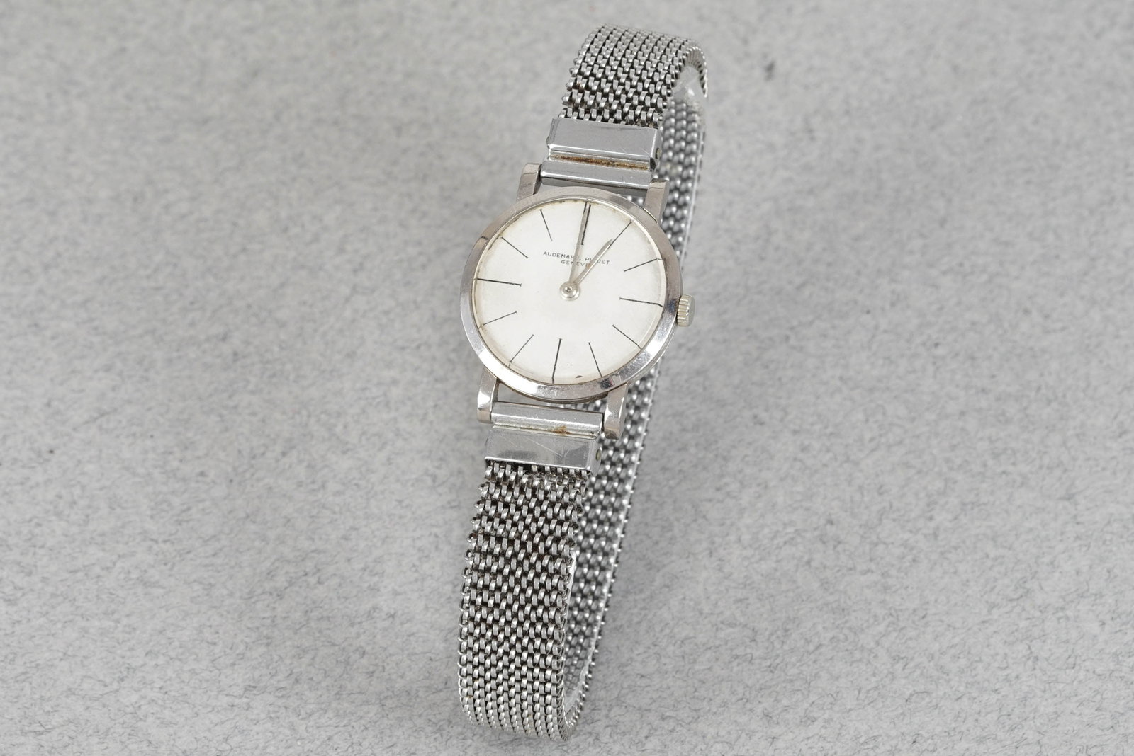 AUDEMARS PIGUET 18CT WHITE GOLD WRISTWATCH: AUDEMARS PIGUET 18CT WHITE GOLD WRISTWATCH DIAL: Circular silver dial, black painted hour markers CASE: 23.5mm 18ct white gold case, snap case back MOVEMENT: Manually wound AP movement BRACELET OR STR