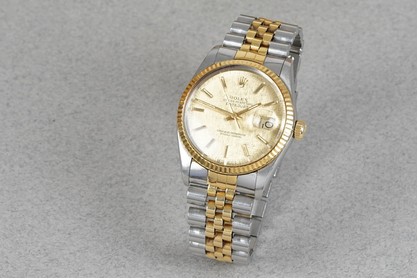 ROLEX OYSTER PERPETUAL DATEJUST STEEL & GOLD 'LINEN' DIAL REF. 16013 CIRCA 1986: ROLEX OYSTER PERPETUAL DATEJUST STEEL & GOLD 'LINEN' DIAL REF. 16013 CIRCA 1986 DIAL: Linen dial texture, applied indices, hands with Lume, date window CASE: 36mm stainless steel and 14k gold