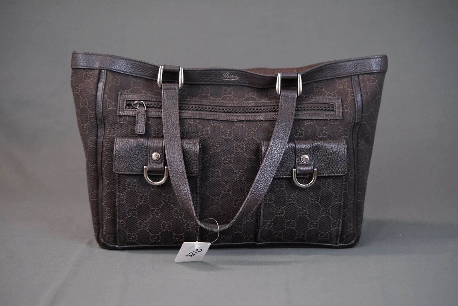 GUCCI GG TOTE BAG: GUCCI GG TOTE BAG DIMENSIONS: Width 32cm, height 24cm, depth 9cm COLOUR: brown MATERIAL: canvas leather trim ACCESSORIES: n/a CONDITION RANK: corners worn general wear If you have any questions