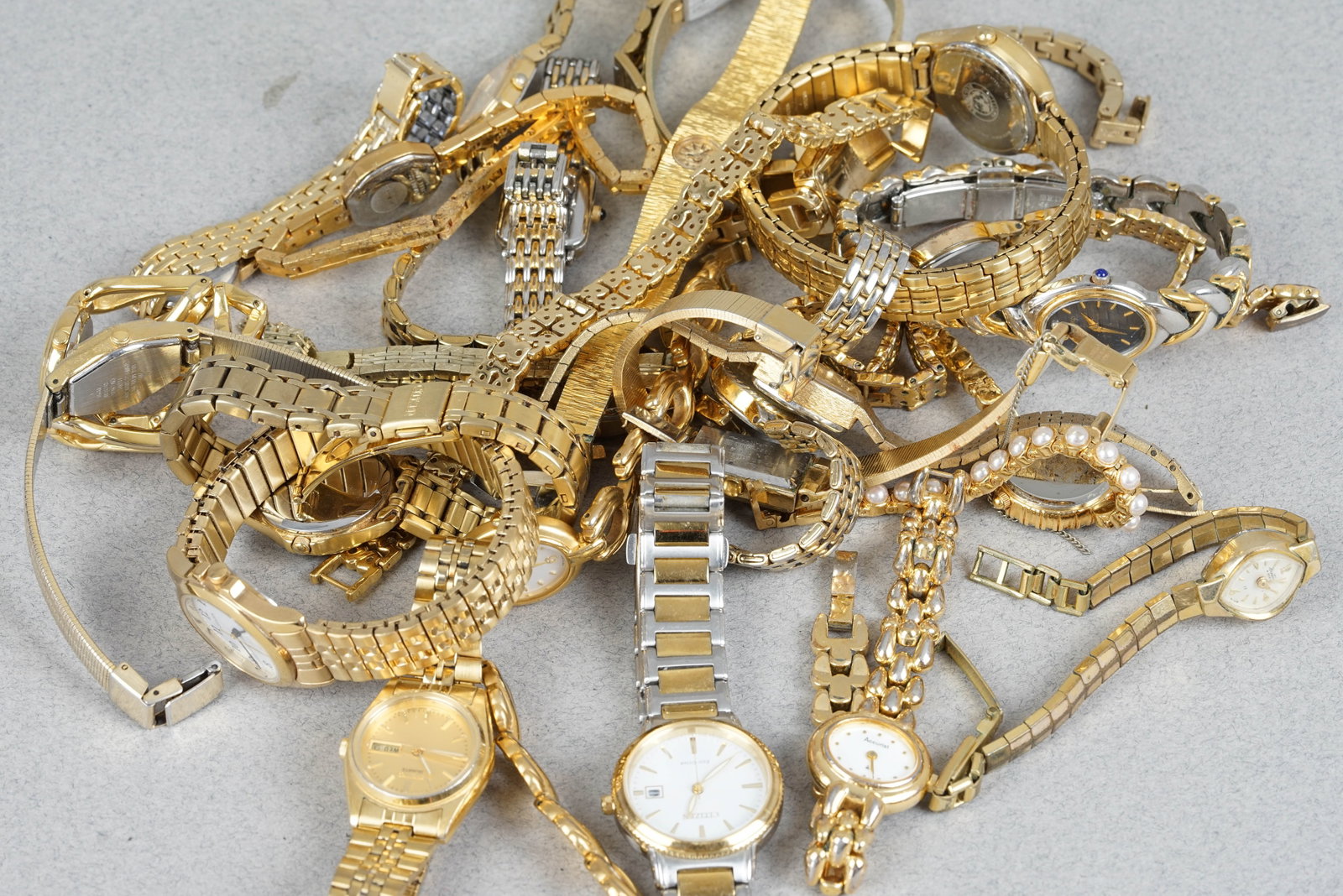 GOLD PLATED COCKTAIL WATCHES BAG OF 25: GOLD PLATED COCKTAIL WATCHES BAG OF 25 DIAL: Various dial styles, mixed conditions CASE: Gold plated cases, various sizes MOVEMENT: Assorted movements BRACELET OR STRAP: Various bracelet and strap