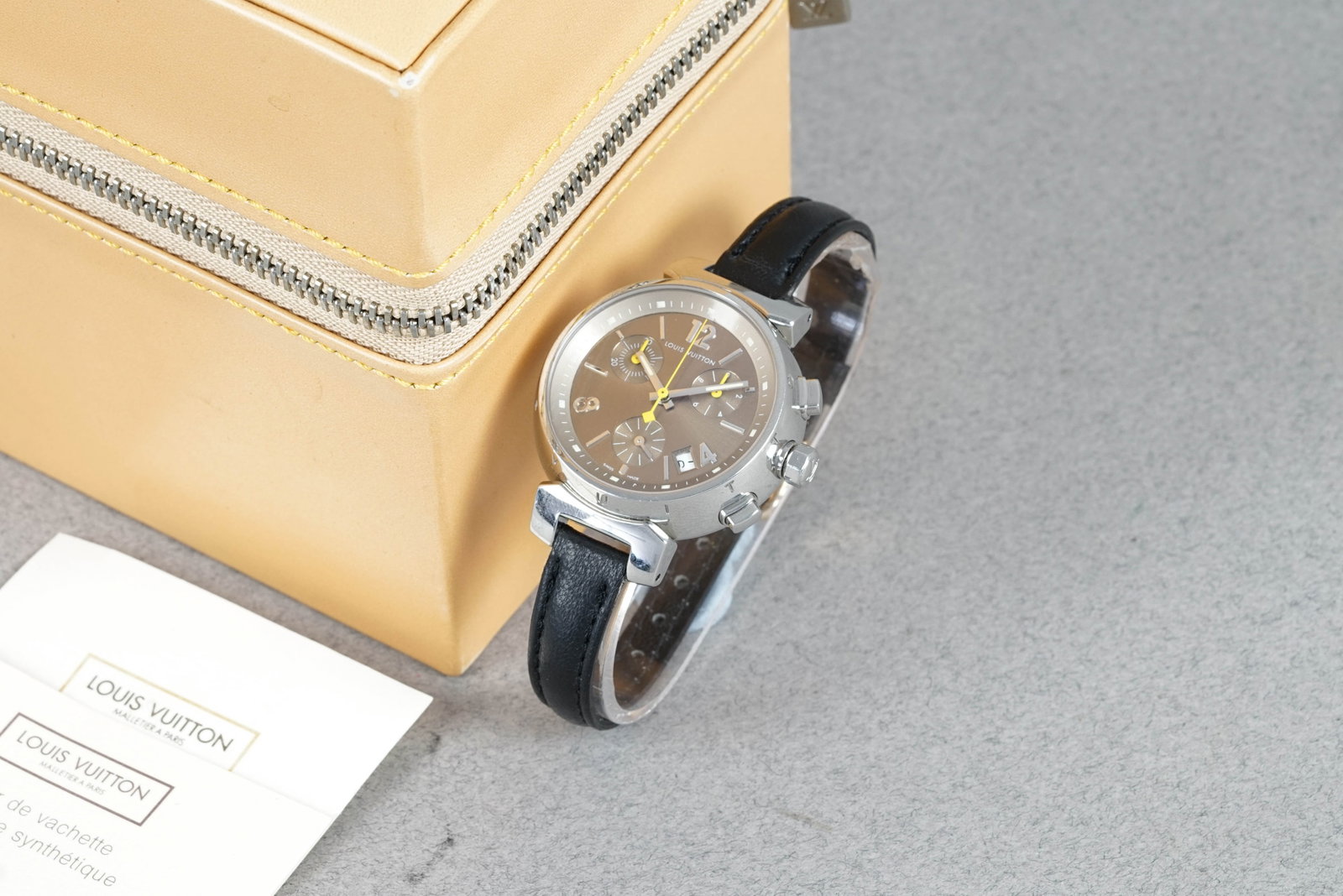 LOUIS VUITTON TAMBOUR CHRONOGRAPH REF. Q1322: LOUIS VUITTON TAMBOUR CHRONOGRAPH REF. Q1322 DIAL: Circular grey/light brown triple register dial, applied hour markers, date window CASE: 34mm stainless steel, pushers, crown MOVEMENT: Quartz