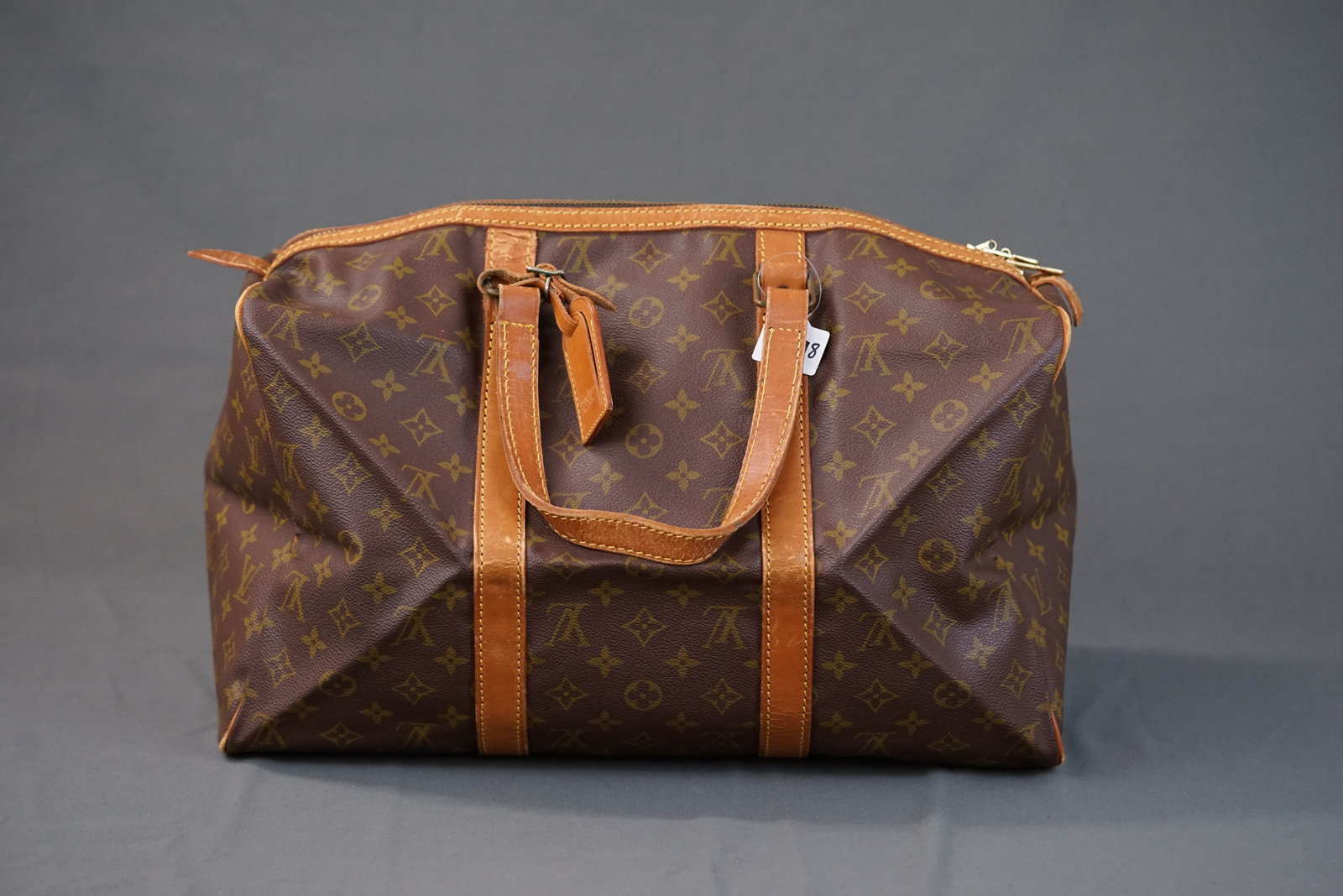 LOUIS VUITTON MONOGRAM SAC SOUPLE BOSTON BAG M41624: LOUIS VUITTON MONOGRAM SAC SOUPLE BOSTON BAG M41624, width cm, height cm, depth cm. If you have any questions regarding this lot please contact us. For further information on our auction, please