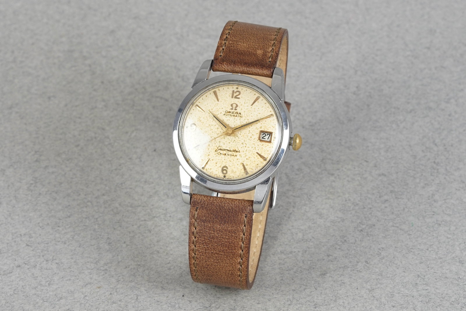 OMEGA SEAMASTER CALENDAR AUTOMATIC WRISTWATCH REF. 2849-3: OMEGA SEAMASTER CALENDAR AUTOMATIC WRISTWATCH REF. 2849-3 DIAL: Circular patina dial with gold hour markers, date window CASE: 34mm stainless steel, snap case back, replacement crown MOVEMENT: