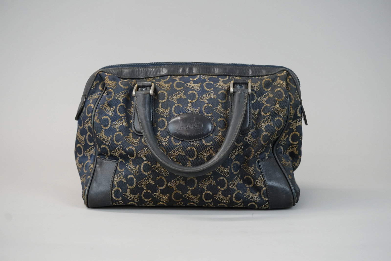 CELINE CANVAS & LEATHER HANDBAG: CELINE CANVAS & LEATHER HANDBAG DIMENSIONS: Width 29cm, height 19cm, depth 13cm COLOUR: Brown MATERIAL: Canvas leather trim ACCESSORIES: n/a CONDITION RANK:C If you have any questions regarding