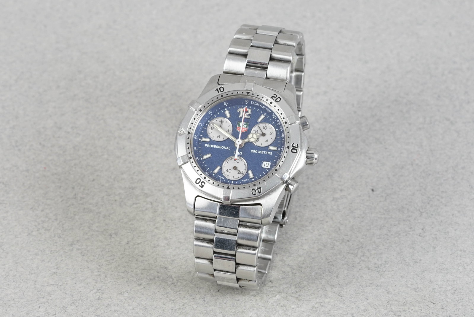 *NO RESERVE* TAG HEUER PROFESSIONAL CHRONOGRAPH W/ BOX REF. CK1112: TAG HEUER PROFESSIONAL CHRONOGRAPH W/ BOX REF. CK1112 DIAL: Circular blue triple register, date window CASE: 38mm stainless steel case, moveable bezel, screw down crown, twin pushers MOVEMENT: Quartz