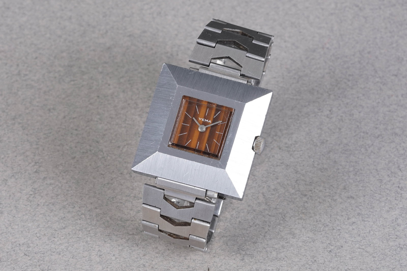 YEMA PYRAMID WRISTWATCH: YEMA PYRAMID WRISTWATCH, this watch is fitted with a square tigers eye style dial with, baton hour markers and hands. The 36mm steel case is fitted with a crown and a screw case back. Inside is a