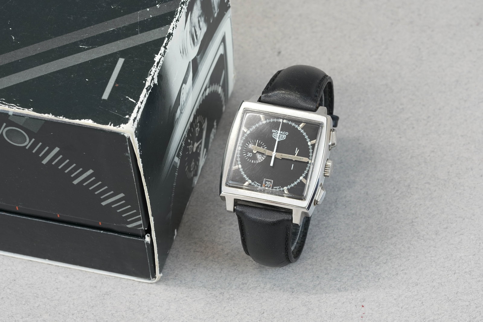 TAG HEUER MONACO LTD EDITION W/ BOX & BOOKLETS REF. CS2110: TAG HEUER MONACO LTD EDITION W/ BOX & BOOKLETS REF. CS2110 DIAL: Black square dial, baton hour markers and hands, 2 sub dials, date window CASE: 38mm square dial, screw case back MOVEMENT: