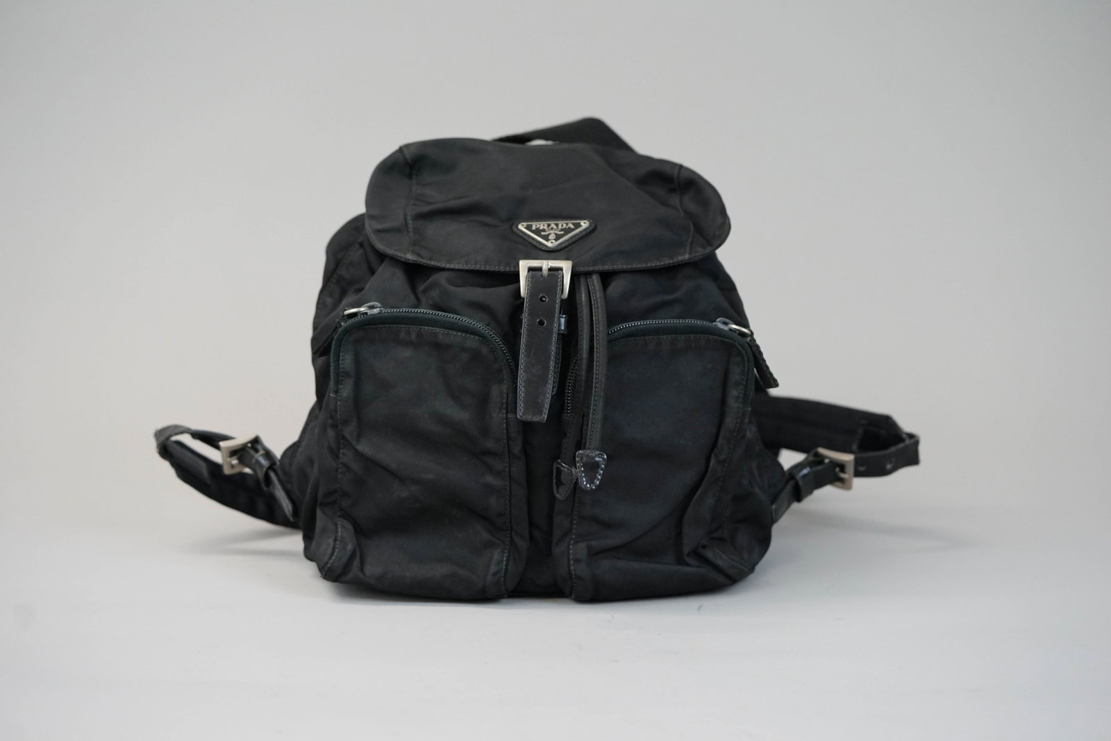 PRADA BLACK BAG: PRADA BLACK BAG DIMENSIONS: Width 24cm, height 26cm, depth 12cm COLOUR: Black MATERIAL: Nylon leather trim ACCESSORIES: n/a CONDITION RANK:BC If you have any questions regarding this lot please