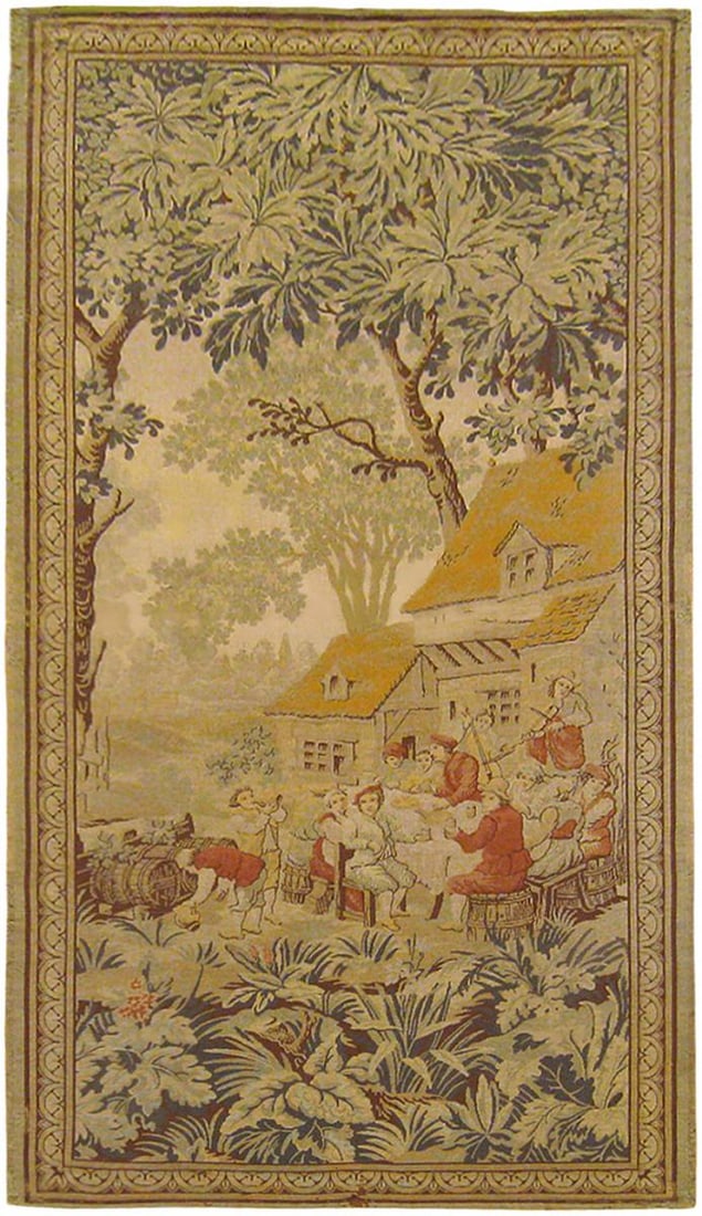 Period Antique Loomed Landscape Tapestry 6'7" H x 3'3" W: A loomed French rustic landscape tapestry from the first quarter of the twentieth century, circa 1920, envisioning a festive scene in which villagers eat, play music, and make merry before a cottage a