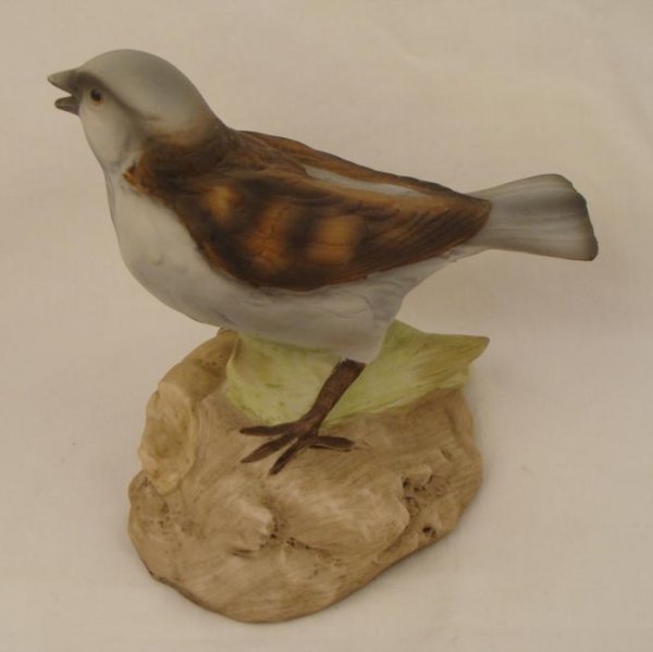 Lefton Mountain Sparrow AG-1740 Vintage Bird Figurine: This mountain sparrow has found a nice cob of corn to feast on. Lefton has created this nicely detailed figurine in hand-painted porcelain. It measures 4 1/2" x 4 1/2". Its condition is excellent, wit