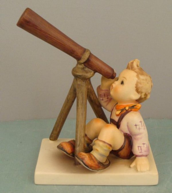 Goebel Hummel STAR GAZER 132 Telescope Figurine 1960-72: This Goebel figurine portrays a boy peering into a telescope, and marvelling at the heavens. Title: Star Gazer Number: 132, incised on bottom of the base Other markings: Incised number 13 Goebel trade