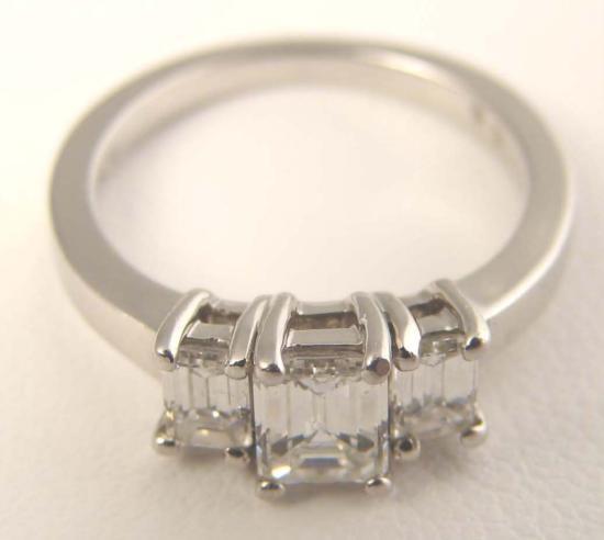 Brilliant Platinum .50 CT. Ring NEIMAN MARCUS Designer: Featured here is a brilliant platinum ring with three square cut stones. In this delicate ring, the single platinum band and clean setting exudes a restrained and subtle elegance. This ring is from Ne
