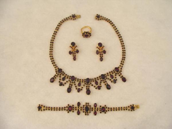 5 Pc Set Antique European Rhinestone Costume Jewelry: This 5 piece set of European vintage costume jewelry features very pretty dark red rhinestones on gold tone settings. All are in very good condition. Necklace: 15 1/2" Bracelet: 7" Earrings: 1 pair, c