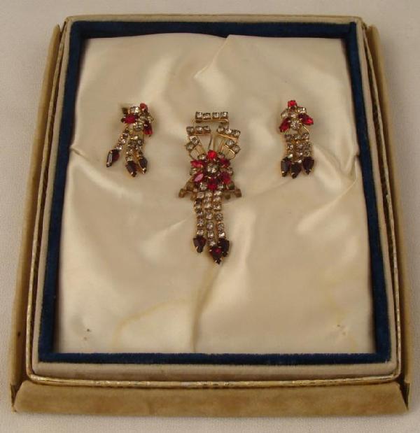 3 Pc Art Deco 12K GF Rhinestone Pendant Earring Set M&S: This is a 3 piece set of Art Deco jewelry adorned with red rhinestones and faux diamonds on expressive gold settings. They come in the original lower section of a sueded box with satin lining, marked 
