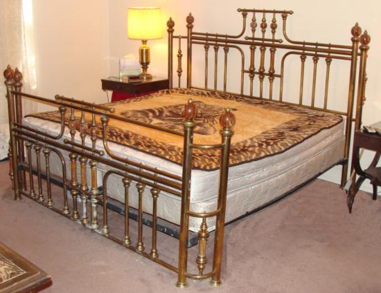 Vintage Brass & Marble Poster Bed King Size Frame: This is a vintage king size brass bed with marble fittings. It is in used but very good condition. The brass frame has a burnished finish. Portions of the brass surface are darkened from age, so it co