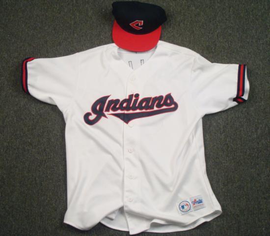 Cleveland Indians All-Seasons Jersey and Fitted Hat MLB: Here we have a brand new hat and a jersey. The hat is from Roman; it's navy blue with a red rim, has an old Cleveand Indians logo, and is fitted.