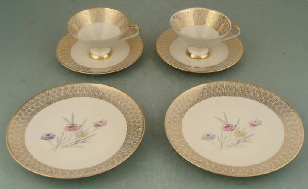 3 Pc Bavarian 1950s Green & Gold Teacup, Plate: This 3 piece Bavarian tea grouping has fancy gold designs and lush green coloring on white porcelain. These are in very good condition, with no chips or cracks, and only some minor scuffs from use. Ea