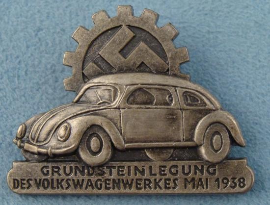 ORIG 1938 VOLKSWAGENWERKS PIN VW, SWASTIKA: THIS IS A GREAT RARE PIECE OF AUTOMOBILE HISTORY. IT IS A LARGE HEAVY METAL MEDAL COMMEMORATING HITLER'S "PEOPLE'S CAR." IT SHOWS AN ORIGINAL VOLKSWAGEN BEETLE CAR WITH SWASTIKA INSIDE OF A GEAR. IT R