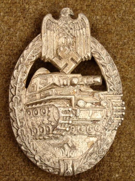 WWII PANZER ATTACK/TANK BADGE-MAKER MARKED- W -SILVER: WWII PANZER ATTACK/TANK BADGE-MAKER MARKED-"W"-IN SILVER OUTSTANDING DETAIL ON THIS ORIGINAL WWII NAZI TANK BADGE -HAS LARGE EAGLE & SWASTIKA ON TOP-OAK LEAVE BORDER WITH A PANZER IN CENTER-M