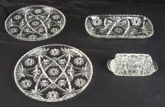 Lot 4 Vintage Starburst Pressed Glass Plates, Tray: Here is a lot of pressed glass pieces, all in a starburst pattern. We don't know the maker or the age, but they date back over 25 years. All are in very good condition, although the tray has some slig