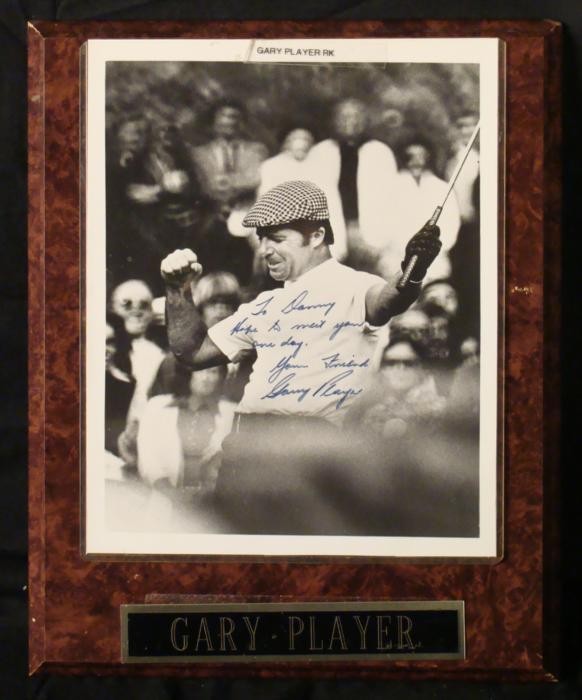 Gary Player Signed Golf Photo Plaque PGA w/ Message: This 8 x 10 photo is on a plaque with metal engraved name plate, and it's signed by Player himself. The autograph is in blue marker, and has a personalized message, which reads "Hope to meet you one d