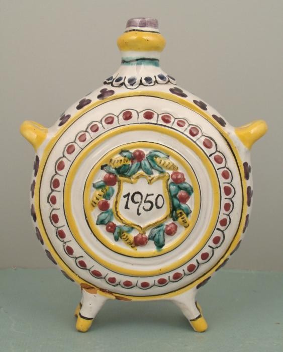 Vintage Czech Country Ceramic Decorative Flask 1950: This ceramic flask was made by one of the Czech pottery makers, in a pattern very much like a plate. At the centers are raised details of grapes on one side, and an escutcheon dated 1950. The bottom h