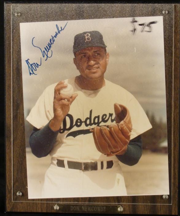 Don Newcombe Signed LA Dodgers Photo Plaque: This 8 x 10 photo on plaque was signed by World Series champion Dodgers pitcher Don Newcombe. The autograph is in blue Sharpie. The photo is a nice on-field shot, and it is in excellent condition. The