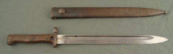 WWII ERA POLISH BAYONET FOR MAUSER RIFLE W/SCABBARD: WWII OR BEFORE POLISH BAYONET & SCABBARD FOR A MAUSER RIGLE. WOOD GRIPS, WITH MINOR CRACKS AND DENTS. RELEASE BUTTON WORKS FINE. ONLY MARKING IS A "C" ON CROSSGUARD.OVERALL LENGTH IS 17 3/4". NICE