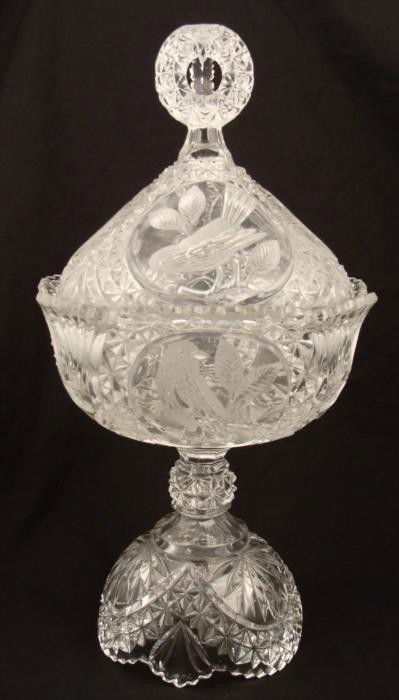 Large Crystal Vintage Glass Bird Pattern Candy Dish: This glass candy dish is fine crystal, with a bird and leaf pattern on the bowl and the lid. A zig zag pattern encircles the rim and the base. The tri-ring handle tops it off with a touch of e