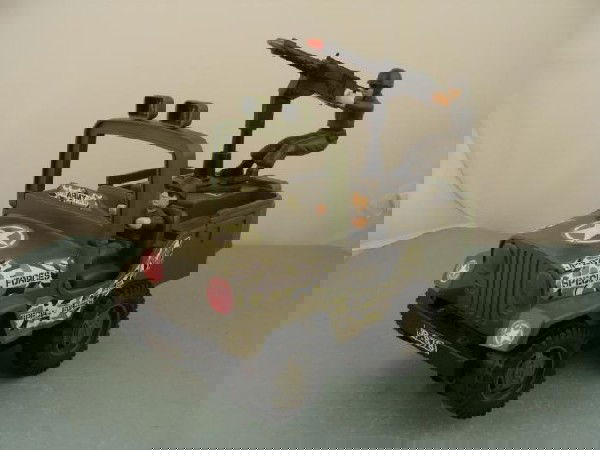 JP-878 Vintage Battery Op Toy Special Forces Army Jeep: This is "Special Forces" model JP-878 battery operated Army Jeep. It is vintage, made over 20 years ago. We have not tested it with batteries, but the battery compartment looks fine. It is des