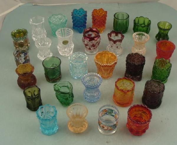 30 Pc Vintage Colored Glass Toothpick Holder Collection: Here is a whole collection of 30 toothpick holders in a variety of colored glass styles and shapes. They are in excellent condition overall. They range from 2" to 2 1/2". Most date anywhere fr
