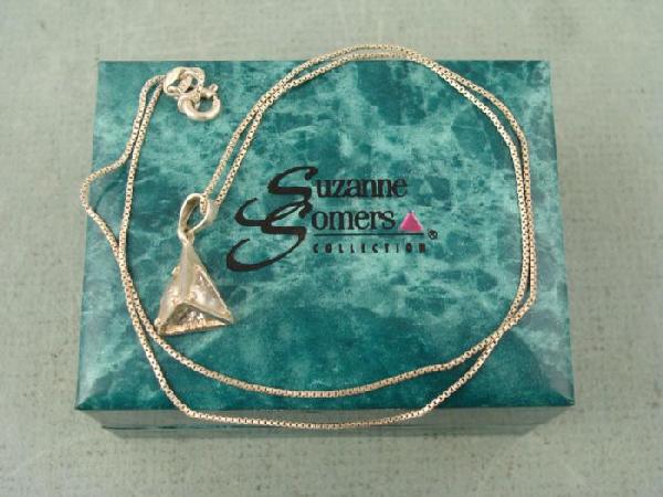 Sterling Silver Suzanne Somers Crystal Necklace In Box: This pendant from the Suzanne Somers collection features a crystal pyramid pendant with a sterling silver setting. It is 5/8" tall, on a 18" chain. It is in excellent condition, and comes in t