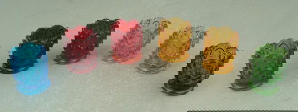 6 Vintage Colored Glass Toothpick Holder Set Collection: These 6 toothpick holders are a vintage set dating from the 1950's. They are classic colored glass with molded star and oval pattern. Their size is 2" x 2 3/8" tall. Their condition is excelle